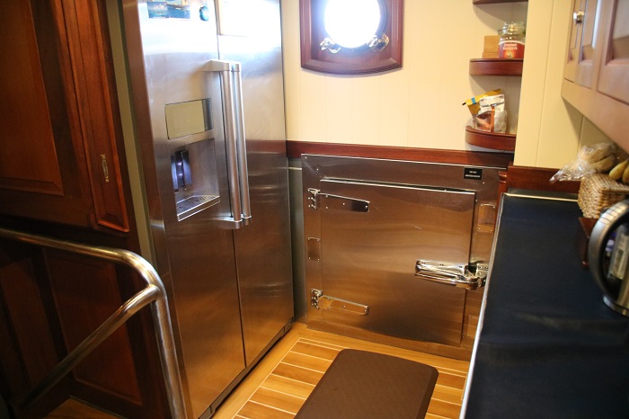 The chef proudly showed me the freezer.  Lots of room to keep the crew well fed. <img class=